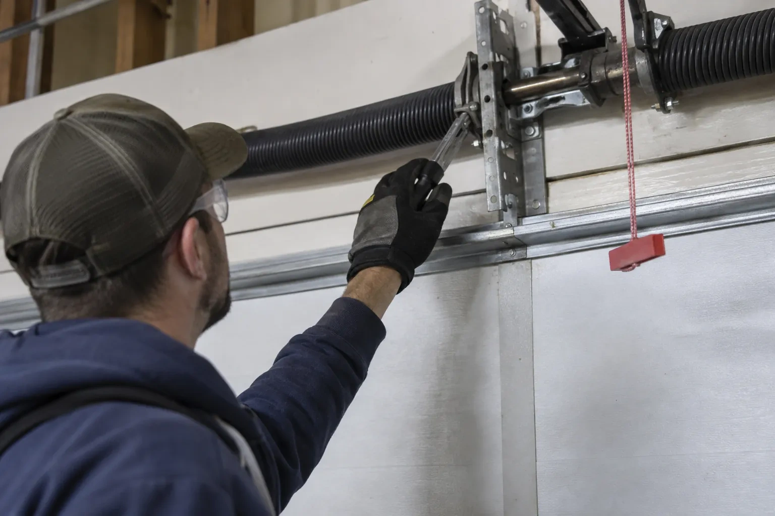 Illustrative garage doors scene; not an actual job